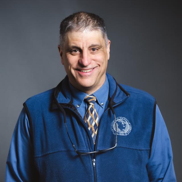 Frank Pazzaglia headshot with a grey background